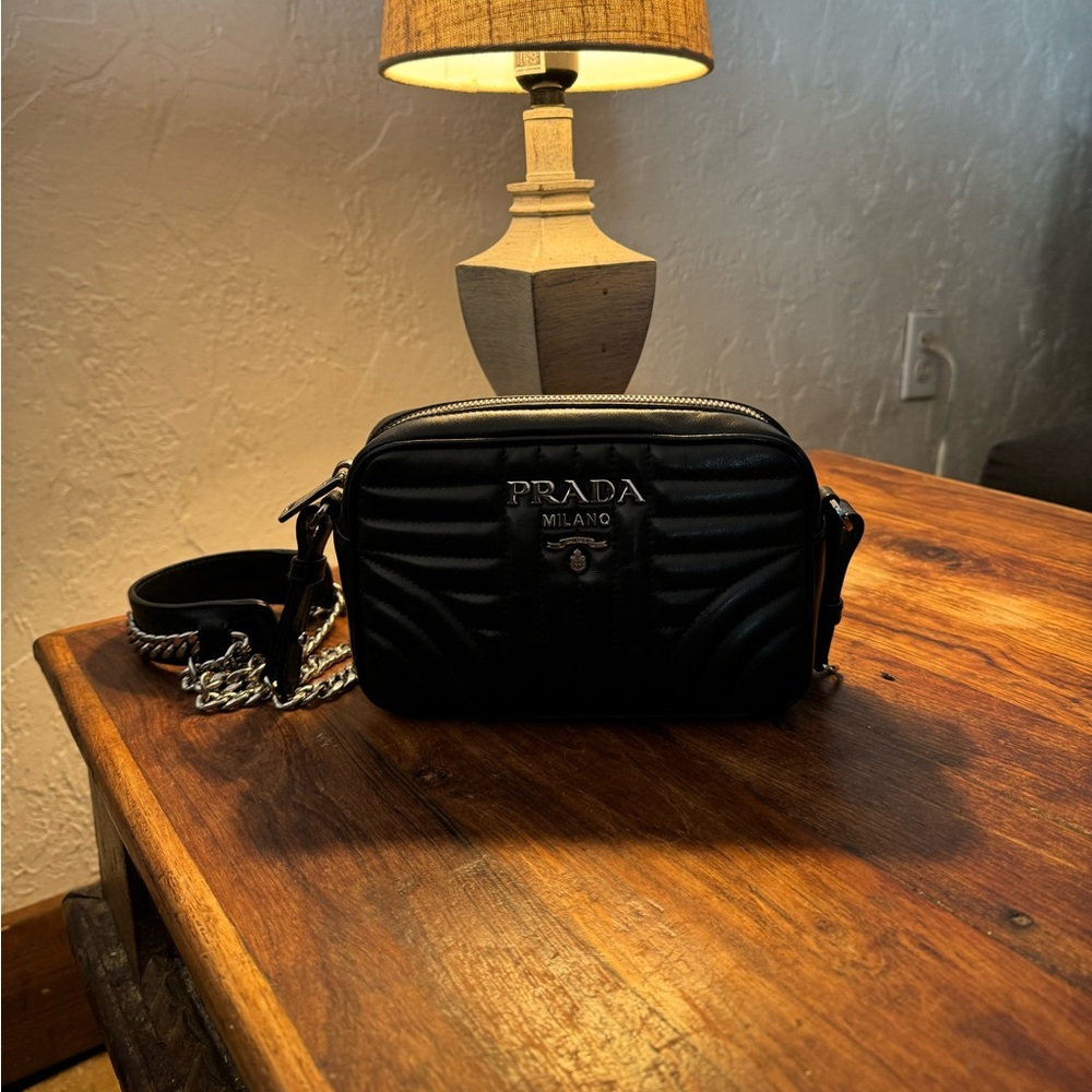 Authentic Prada black leather shoulder purse. Over $1000 new and never used.